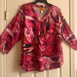 What beautiful blouse fabulous colors. Perfect condition. 100% polyester.size 1X
